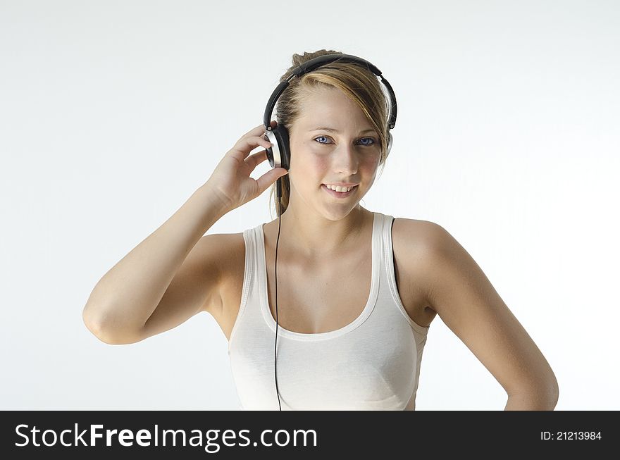 A girl listening to music on her headphones