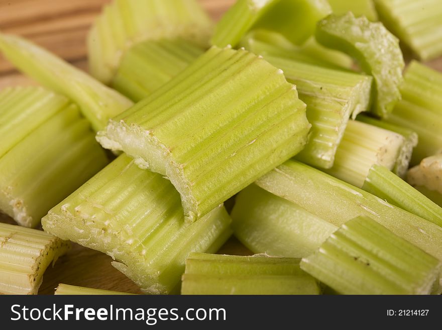 Sliced Celery on a wooden chopping board