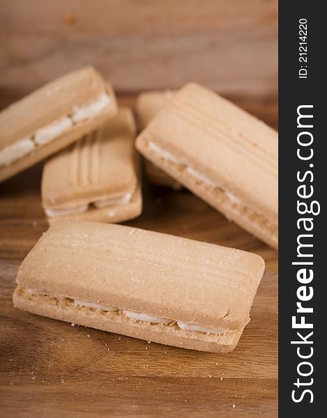 Cream biscuits on a wooden chopping board