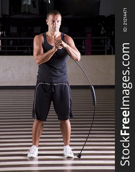 Fitness instructor leaning on the spring while working out. Fitness instructor leaning on the spring while working out