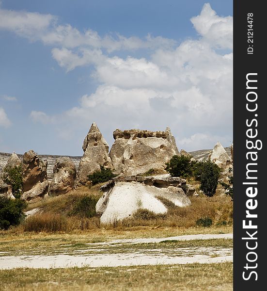 Landscape of unusual sandstone and limestone formation on the outskirts of Goreme Cappadocia Turkey from volcanic activity, horizontal, crop space and copy space. Landscape of unusual sandstone and limestone formation on the outskirts of Goreme Cappadocia Turkey from volcanic activity, horizontal, crop space and copy space