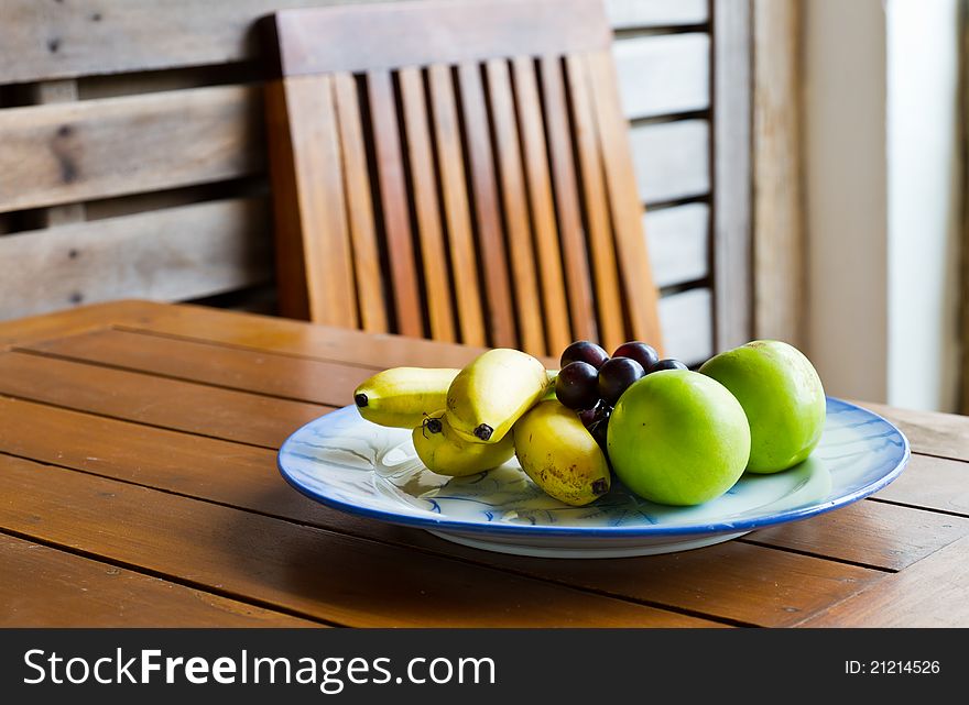 Tropical fruits on the wooden table. Tropical fruits on the wooden table