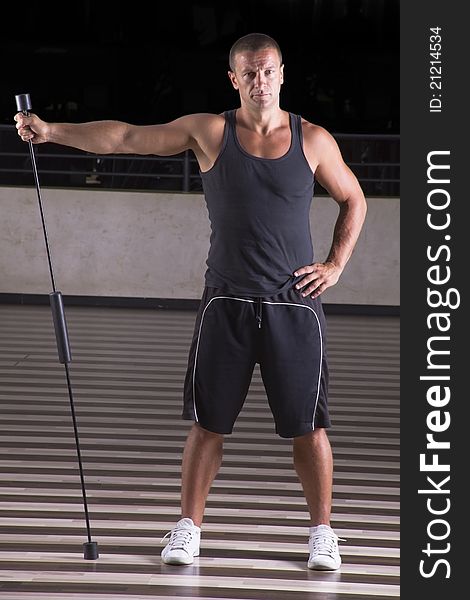Fitness instructor standing straighten up leaning on spring