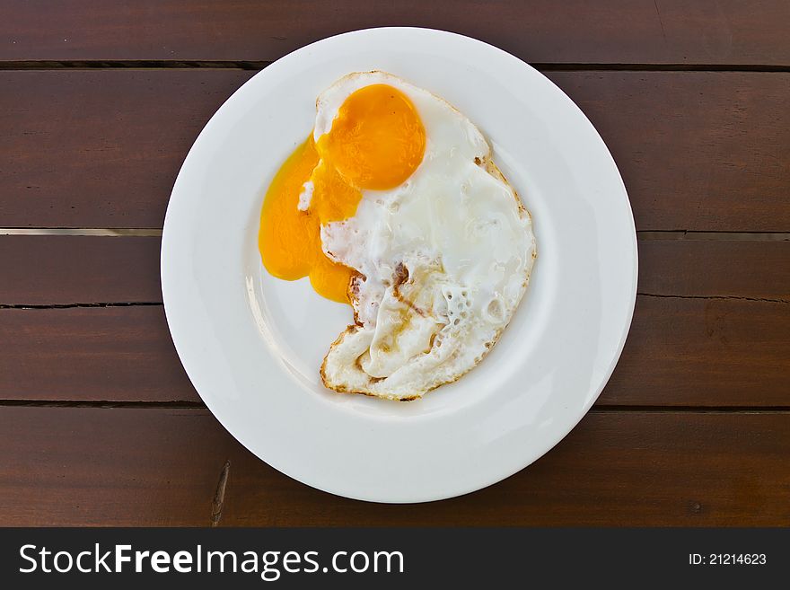 Fried Egg On Wood Table