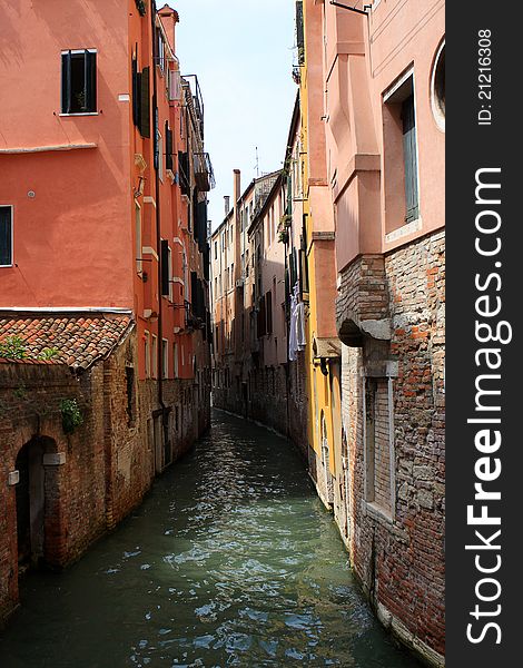 Photo of narrow canal in Venice, Italy
