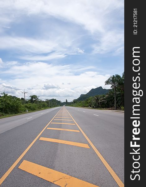 Contry road in Thailand with blu sky and cloud