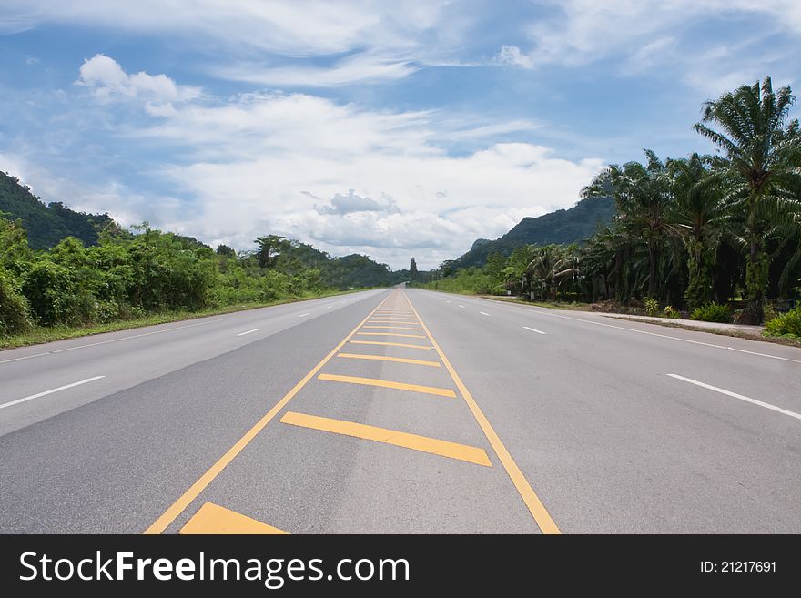 Contry road in Thailand with blu sky and cloud