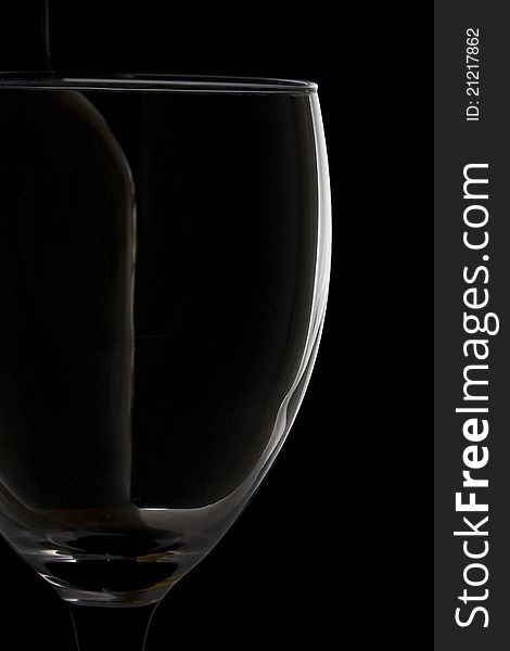 Impression of a wine glass and wine bottle against a black background. Impression of a wine glass and wine bottle against a black background