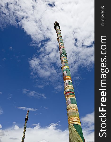 Two prayer flag poles outside jokhang temple in lhasa, tibet. Two prayer flag poles outside jokhang temple in lhasa, tibet.