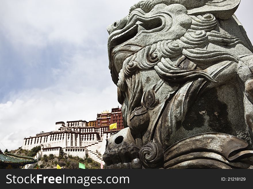 Tibet: stone lion and potala palace