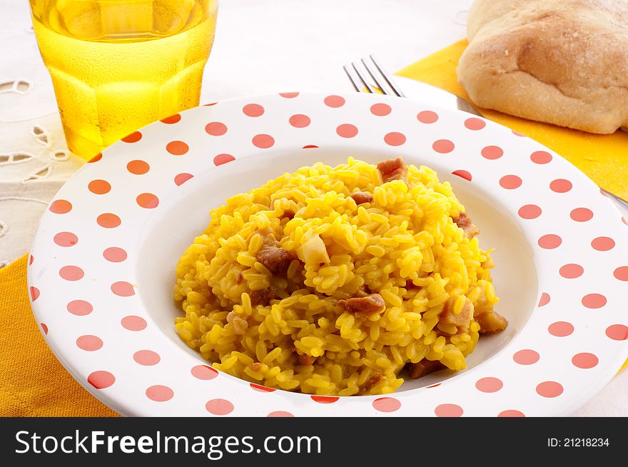 Italian traditional rice with saffron and ham. Italian traditional rice with saffron and ham