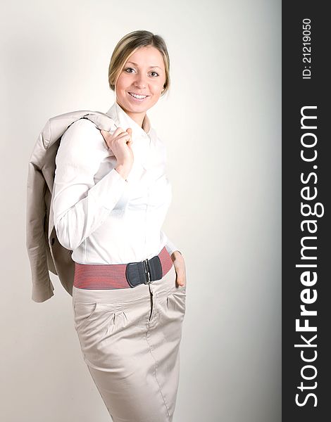 Attractive blonde woman in professional business suit standing