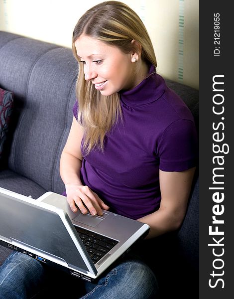 Beautiful woman working on laptop at home