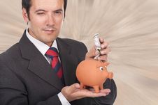Man  Holding A Piggy Bank And Dollar Bills Royalty Free Stock Images
