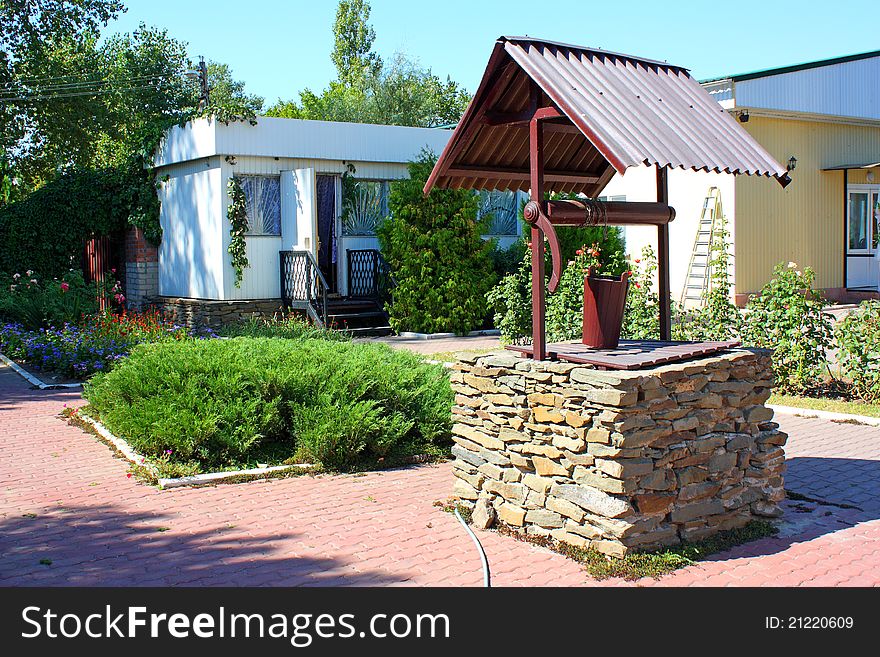 Color photo of a well in a patio