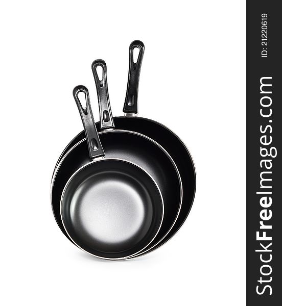 Three new black frying pan on white background. Isolated with clipping path. Three new black frying pan on white background. Isolated with clipping path