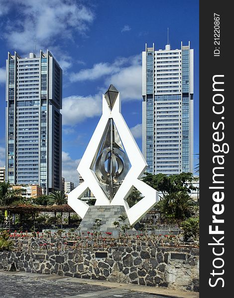 Modern sculpture in park in front of twin towers.santa cruz. tenerife. Modern sculpture in park in front of twin towers.santa cruz. tenerife