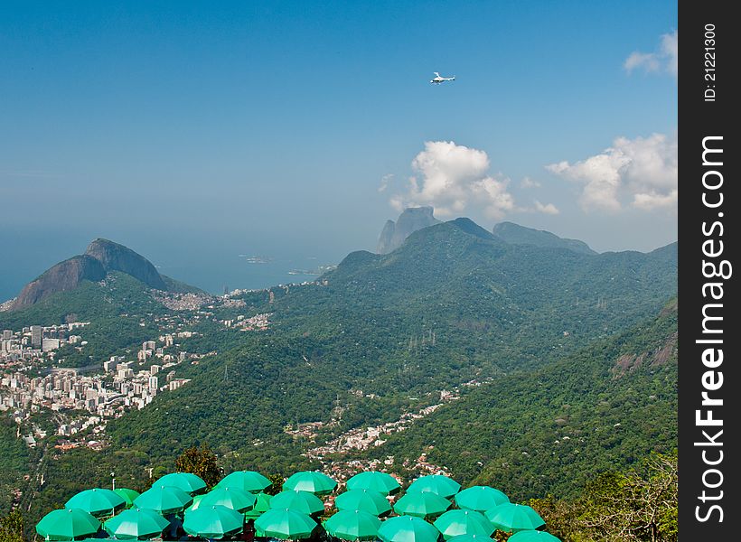 A helicopter takes tourists on a sightseeing tour of the city, as viewed from Corcovado Mountain. A helicopter takes tourists on a sightseeing tour of the city, as viewed from Corcovado Mountain.