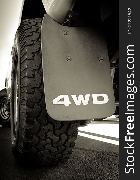 4WD sign and tire of a big truck. 4WD sign and tire of a big truck