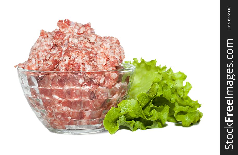 Glass bowl with minced meat and herbs on white background