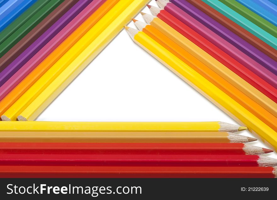 Triangular frame made of colored pencils on a white background