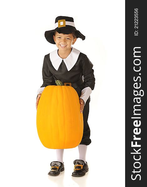 An adorable preschooler dressed as a Pilgrim happily lifting a large pumpkin. Isolated on white. An adorable preschooler dressed as a Pilgrim happily lifting a large pumpkin. Isolated on white.
