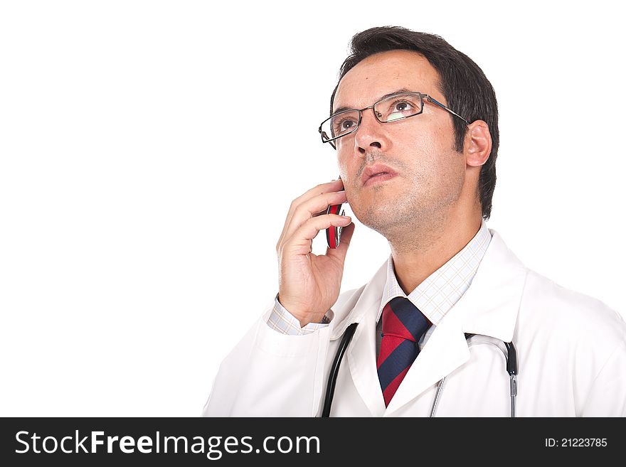 Young doctor talking on the phone and looking worried