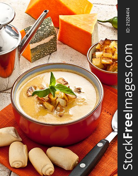 Pumpkin soup with fried potato and croutons