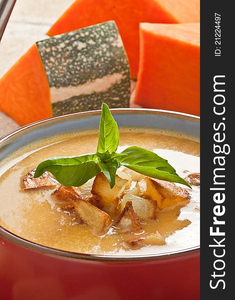 Pumpkin soup with fried potato and croutons