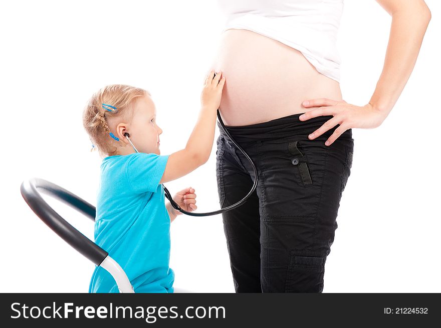 Child with stethoscope listening pregnant belly. Child with stethoscope listening pregnant belly