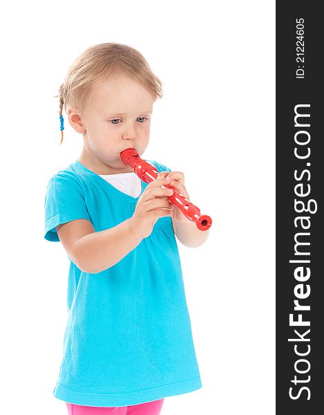 Little girl in the studio playing the flute. Little girl in the studio playing the flute