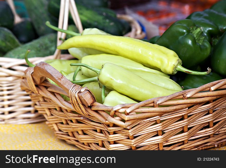 Basket with Cubanelle and green bell peppers. Basket with Cubanelle and green bell peppers