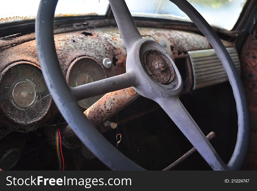 Old dirty and rusted truck steering wheel.