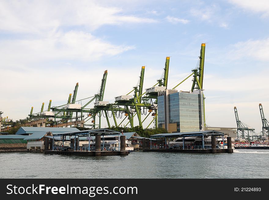 Gigantic Lifting Cranes At A Container Port. Gigantic Lifting Cranes At A Container Port