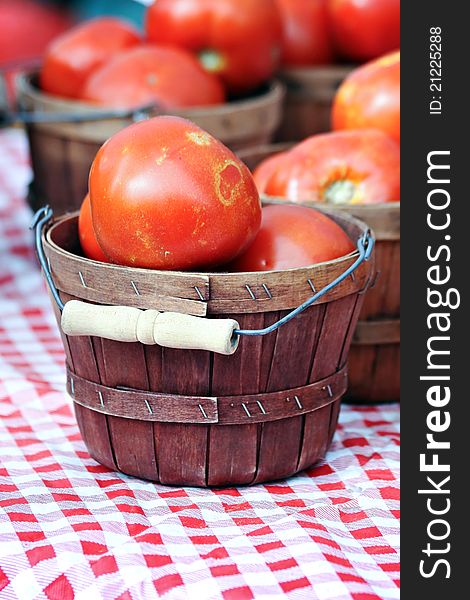 Large tomatoes in brown baskets. Large tomatoes in brown baskets