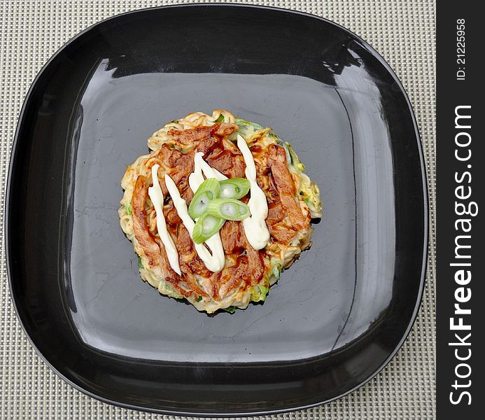 Japanese savoury pancake called okonomiyaki. Japanese savoury pancake called okonomiyaki