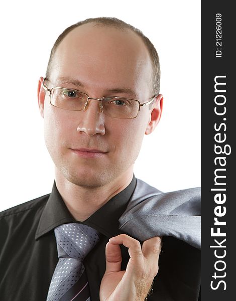 Close-up portrait of a handsome young man in a business suit on the white background. Close-up portrait of a handsome young man in a business suit on the white background.