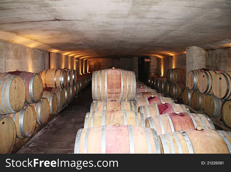 Wine cellar with rows of oak barrels