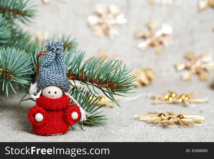 Christmas decorations and branch on burlap background. Christmas decorations and branch on burlap background