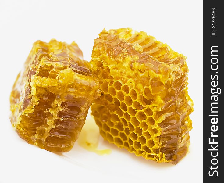 Gold honey honeycombs isolated on white background. Gold honey honeycombs isolated on white background