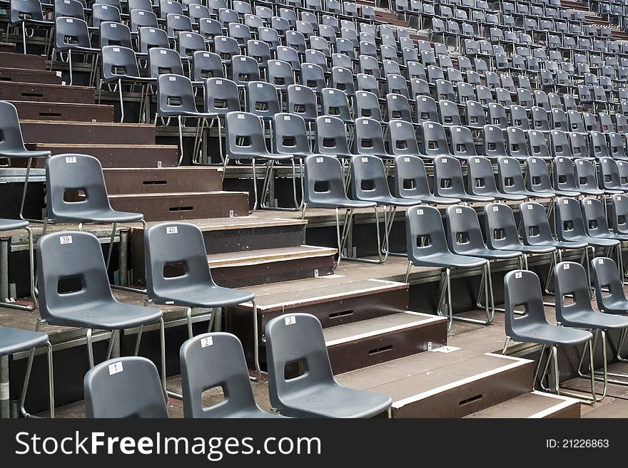 Plenty of  grey seats arranged on temporary hall. Plenty of  grey seats arranged on temporary hall