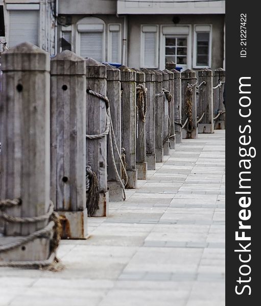 Vertical portrait of quayside wharf in Istanbul, berths bollards quays and public footpath, crop space and copy area. Vertical portrait of quayside wharf in Istanbul, berths bollards quays and public footpath, crop space and copy area