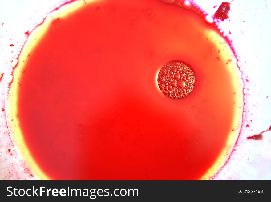 Here is some beetroot juice with olive oil, left from beetroot salad, in a white plate. Here is some beetroot juice with olive oil, left from beetroot salad, in a white plate