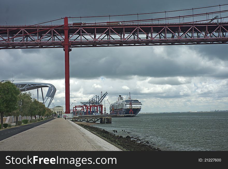 Bridge of 25 April and the ocean port withthe ship. Portugal, Lisboa. Bridge of 25 April and the ocean port withthe ship. Portugal, Lisboa.