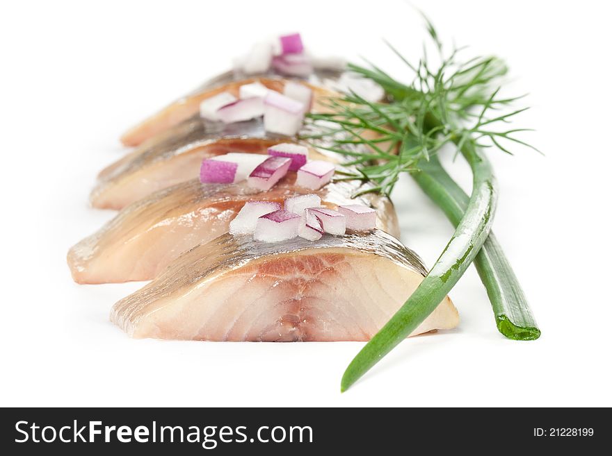 Isolated pieces of salt fillet herring with onion