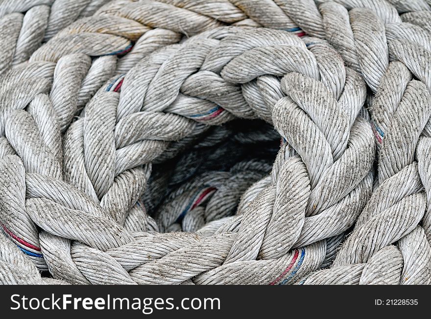 Heavy twisted rope on the floor of sailboat. Heavy twisted rope on the floor of sailboat