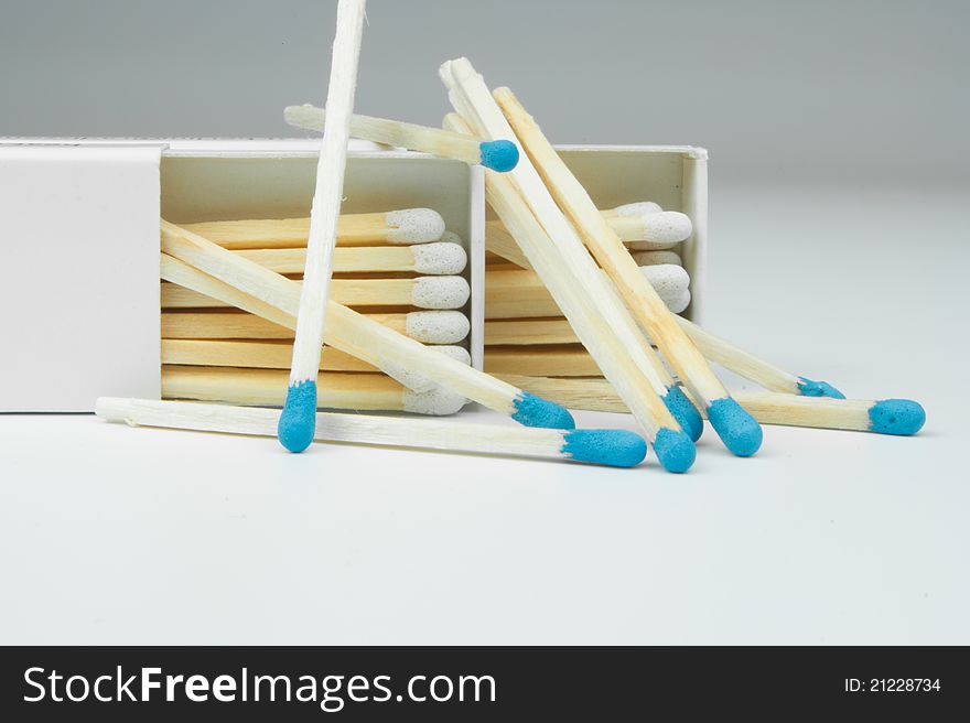 2 box of matches with a blue gray on a white background