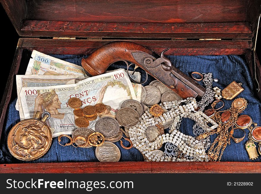 A trunk full of coins and precious jewelry. A trunk full of coins and precious jewelry