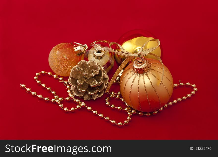 Gold Christmas decorations over red