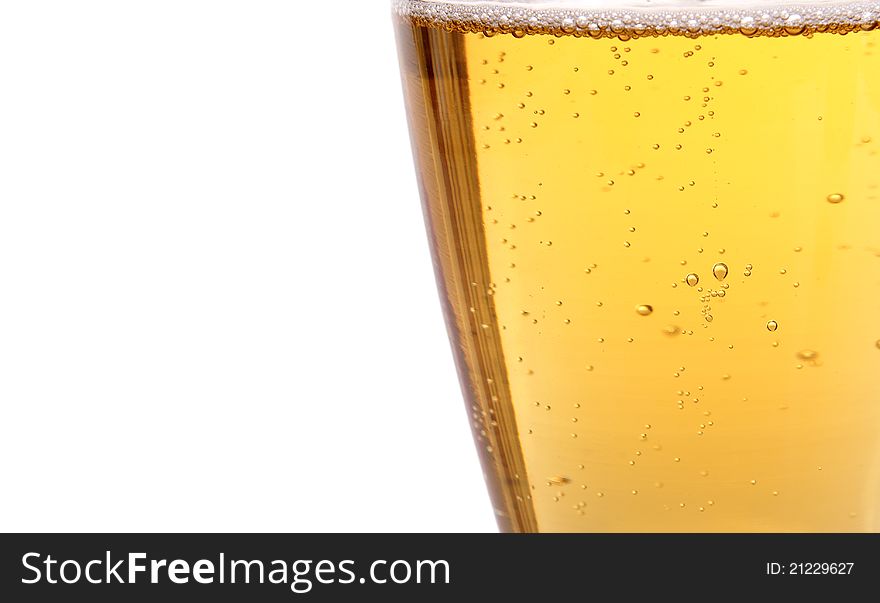 Glass of beer with bubbles on the white background. Glass of beer with bubbles on the white background